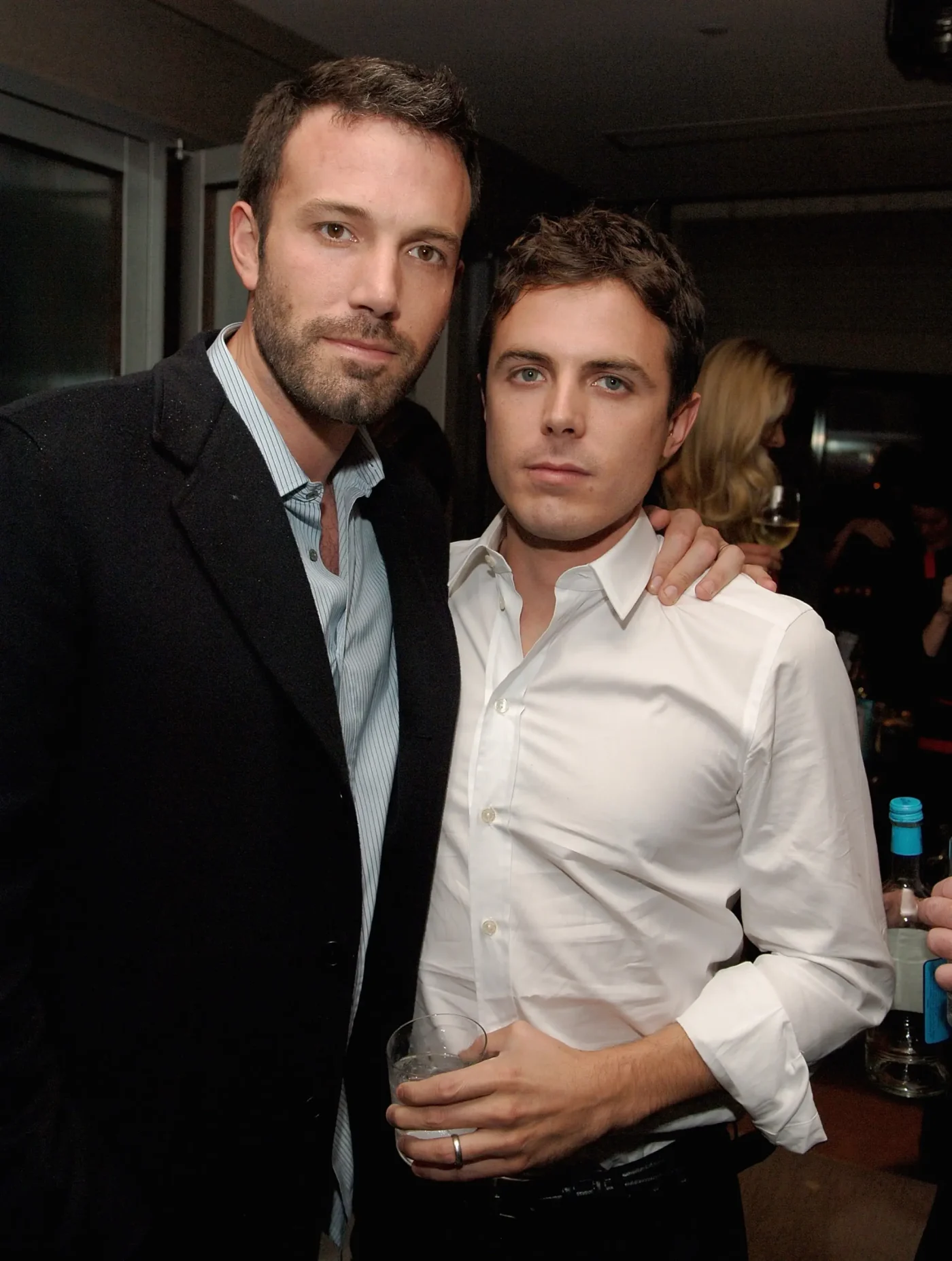 Ben Affleck and Casey Affleck posing together at an event.