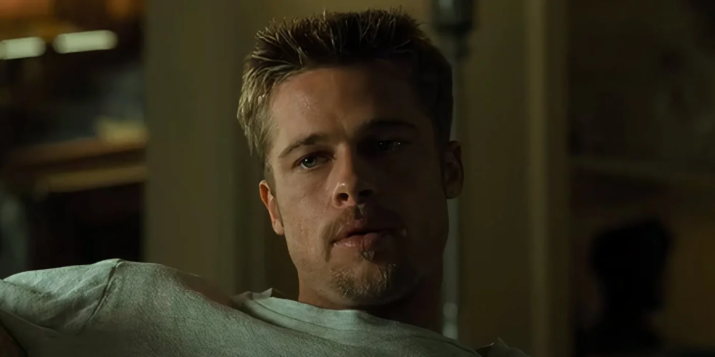 Brad Pitt as David Mills sitting casually in Se7en