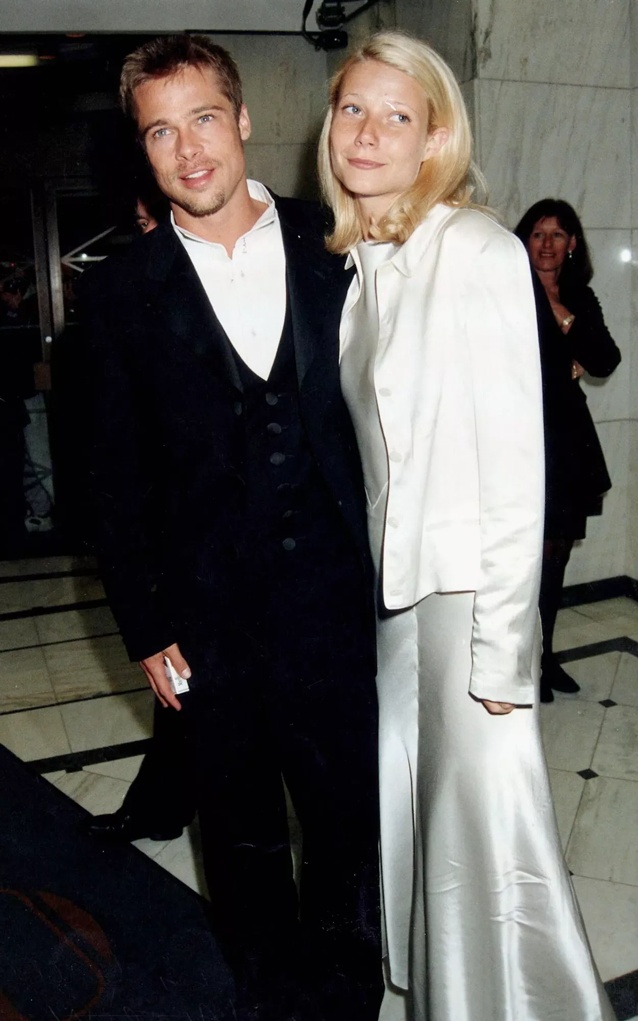 Brad Pitt (L) and Gwyneth Paltrow attend the