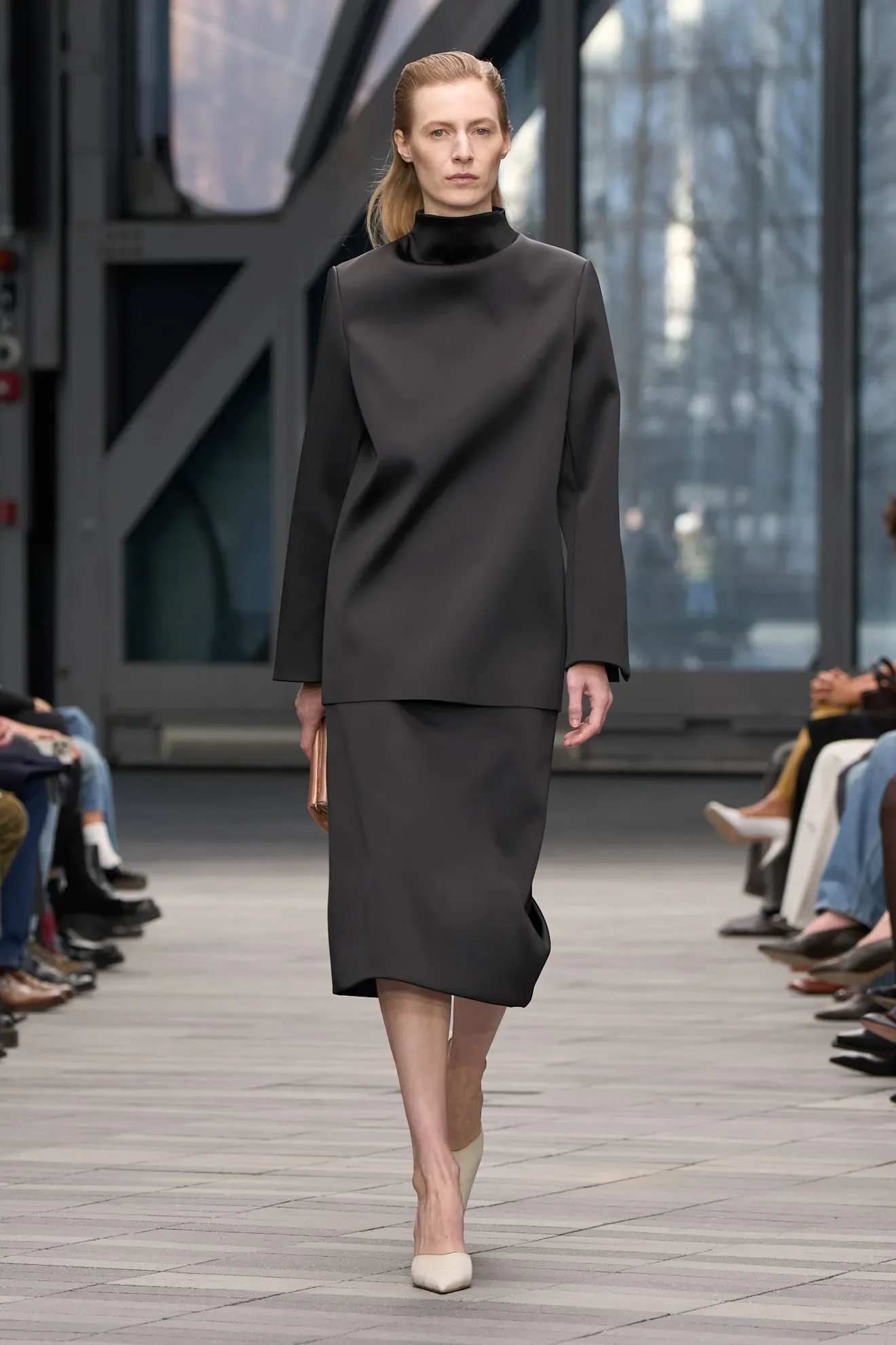 Image may contain Adult Person Clothing Formal Wear Suit Coat and Fashion