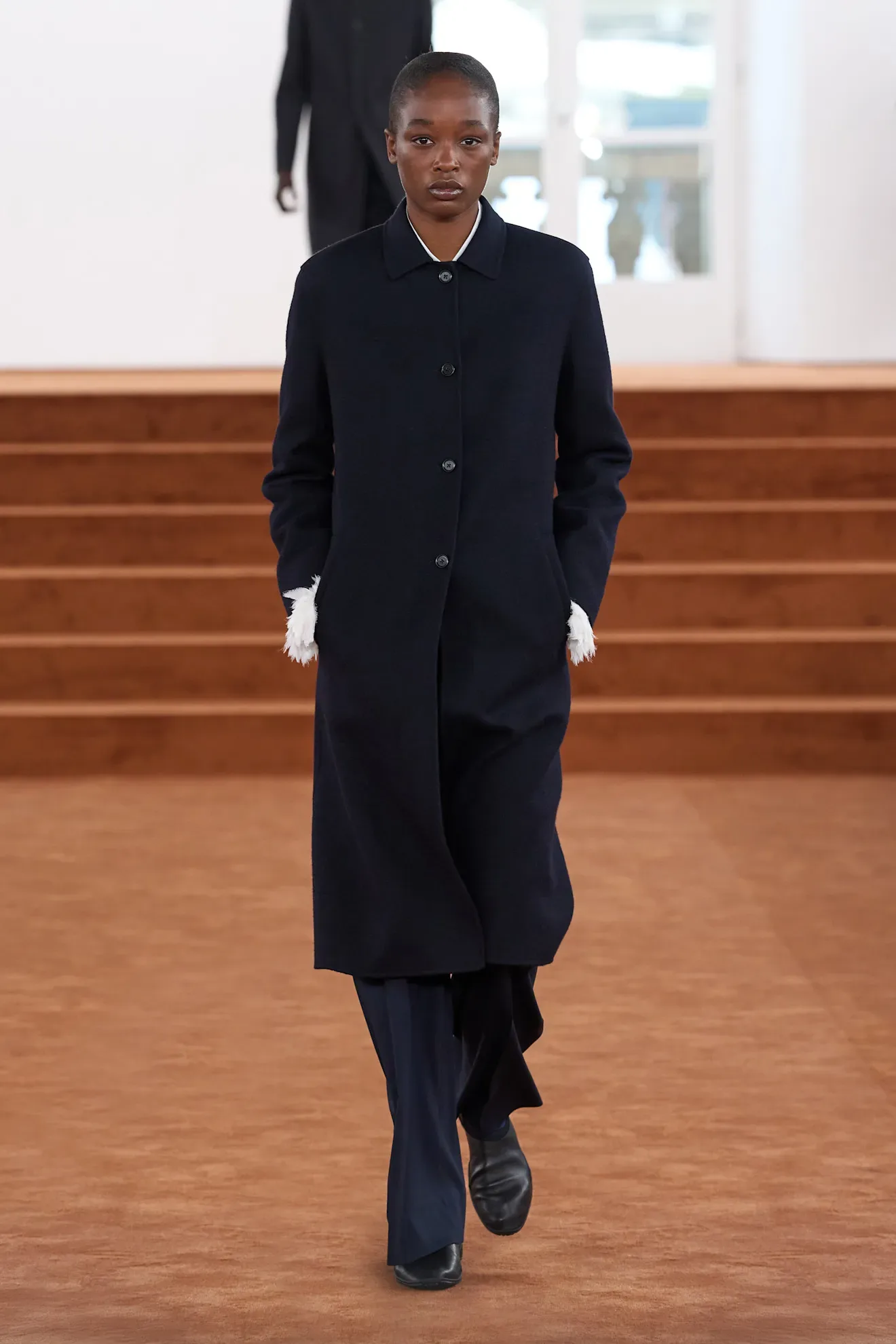 Image may contain Clothing Coat Person Standing Adult and Overcoat