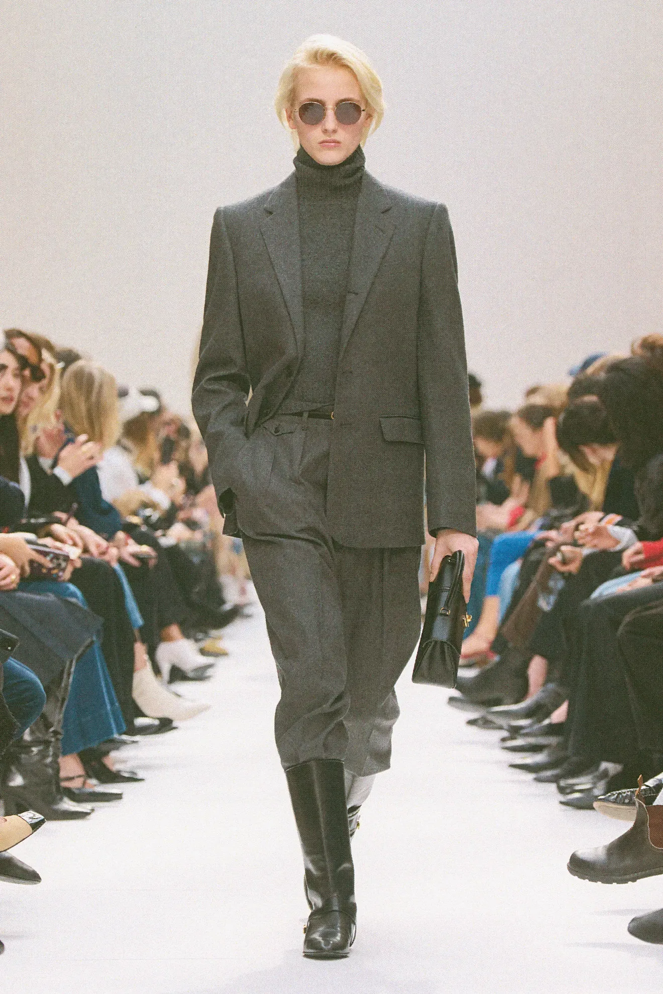Image may contain Clothing Formal Wear Suit Blazer Coat Jacket Adult Person Footwear and Shoe