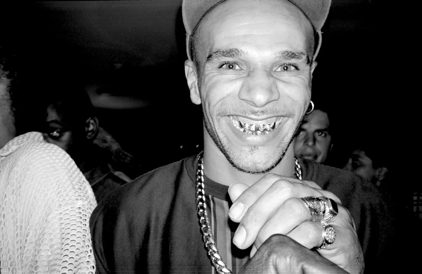 Image may contain Goldie Body Part Mouth Person Teeth Face Head Photography Portrait Finger Hand Happy and Smile
