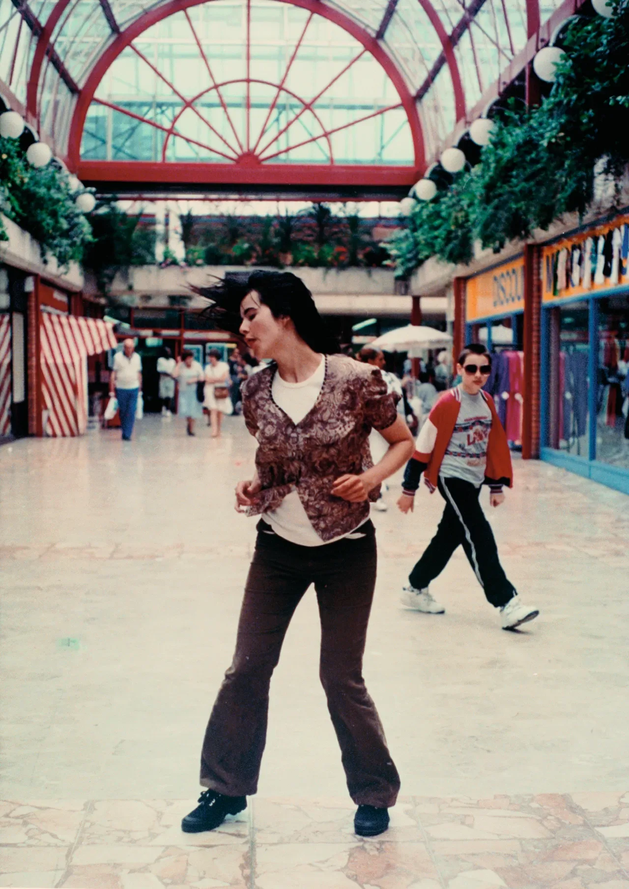 Image may contain People Person Photography Walking Adult Teen City Road Street Urban Architecture and Building