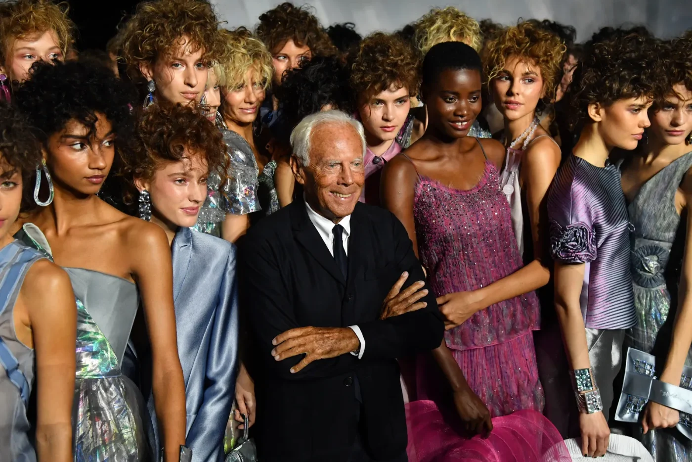 Italian fashion designer Giorgio Armani and models acknowledge applause following the presentation of the Armani...