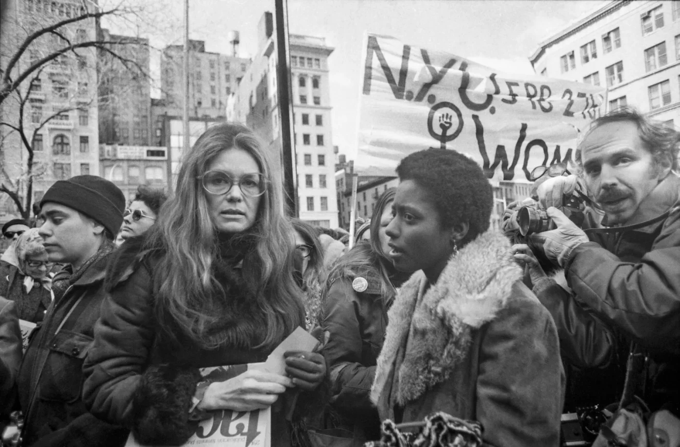 Rep. Bella Abzug feminist Gloria Steinem and Lt. Gov. Maryann Krupsak of New York chat with the marchers and newsmen...