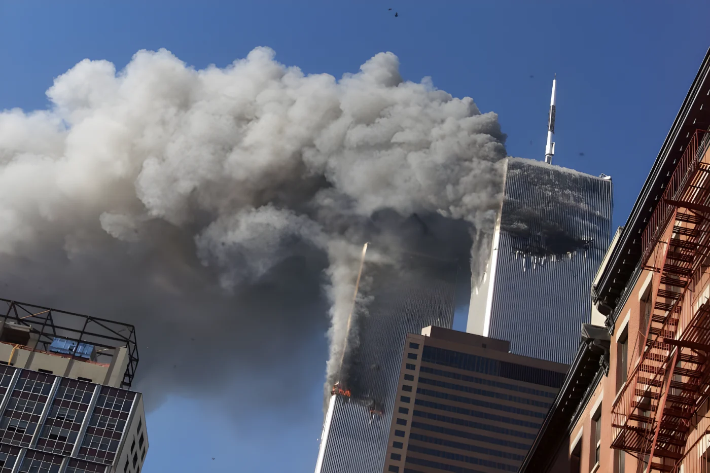 Smoke billows from the burning twin towers of the World Trade Center after hijacked planes crashed into the towers in New York City.