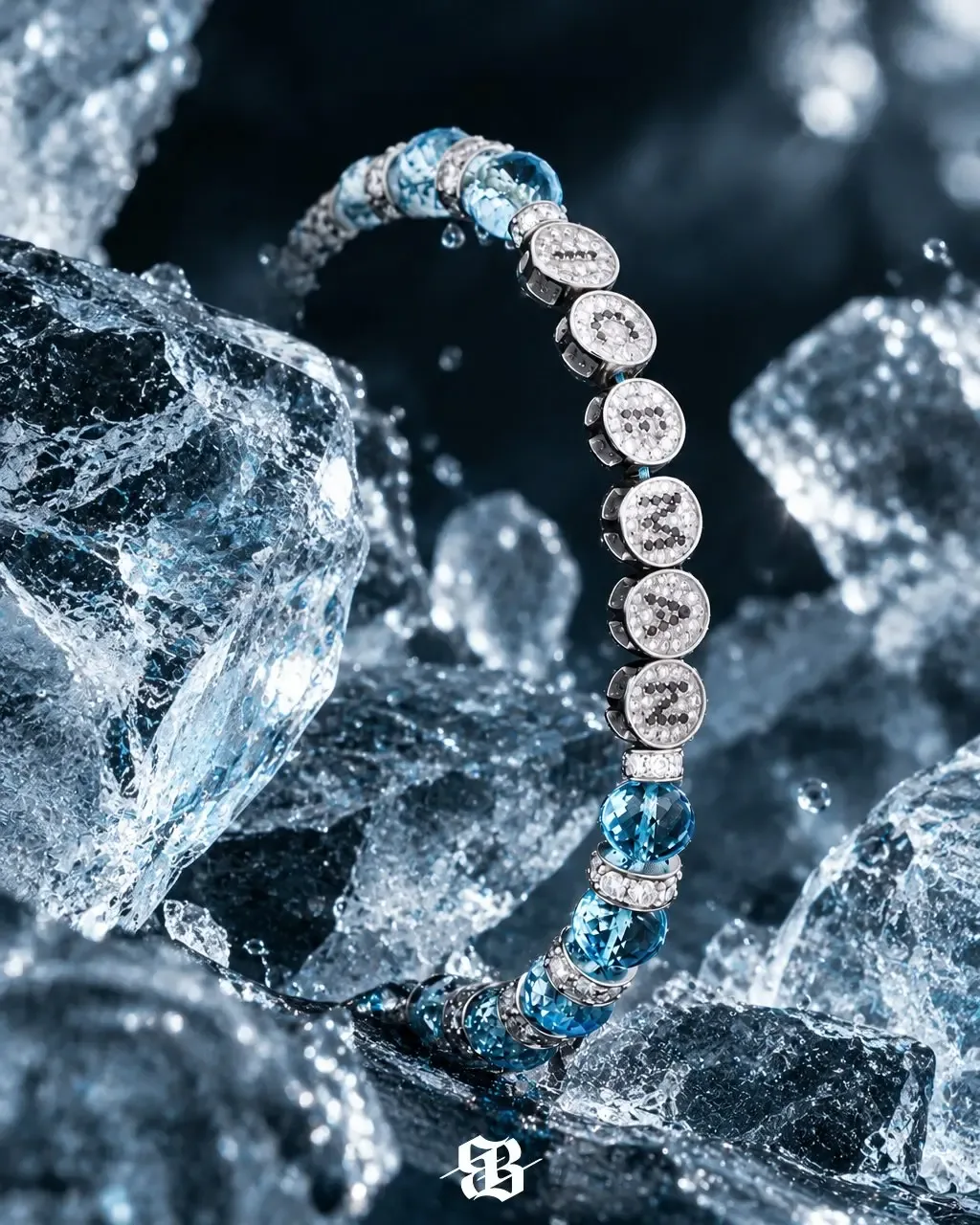 A diamond and blue gemstone bracelet resting among chunks of ice.