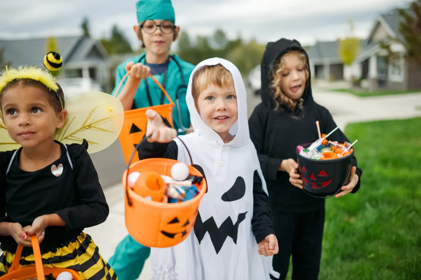 A group of kids trick or treating.