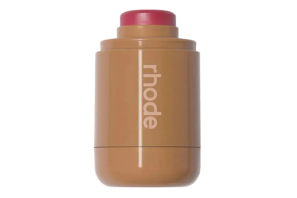 A rhode blush stick against a white background.