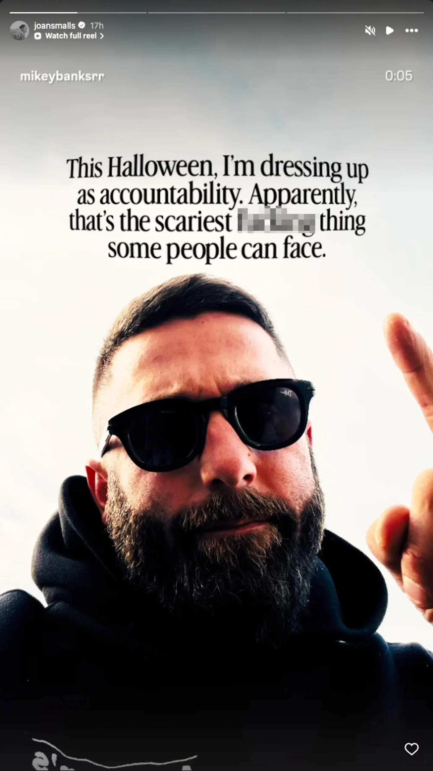 A screenshot of an Instagram Story showing a bearded man wearing sunglasses and a hoodie, with text that reads, "This Halloween, I