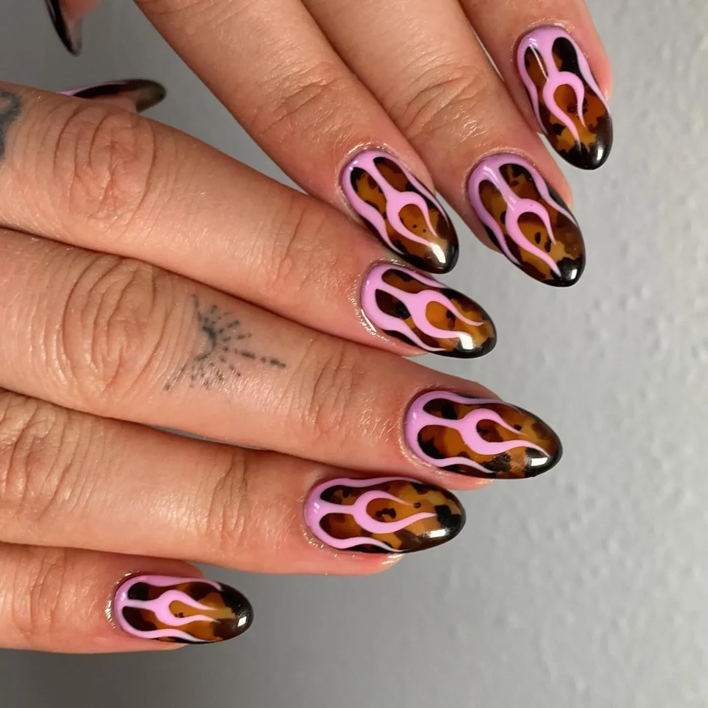 A set of nails with an intricate flameinspired design