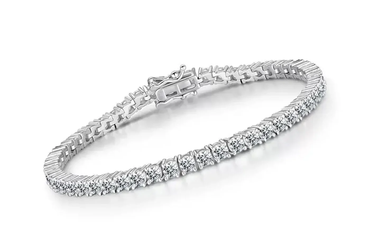 A silver tennis bracelet with a row of sparkling stones and a secure clasp on a white background.