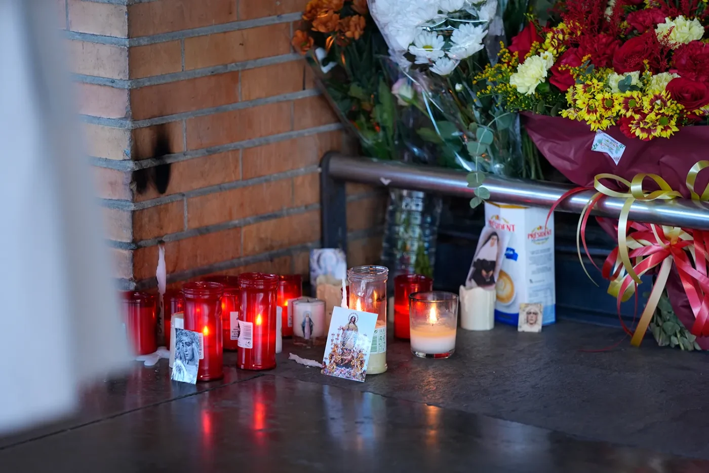 A small altar with flowers and candles in memory of the victims at Santa Justa station in Seville following the train accident in Urda