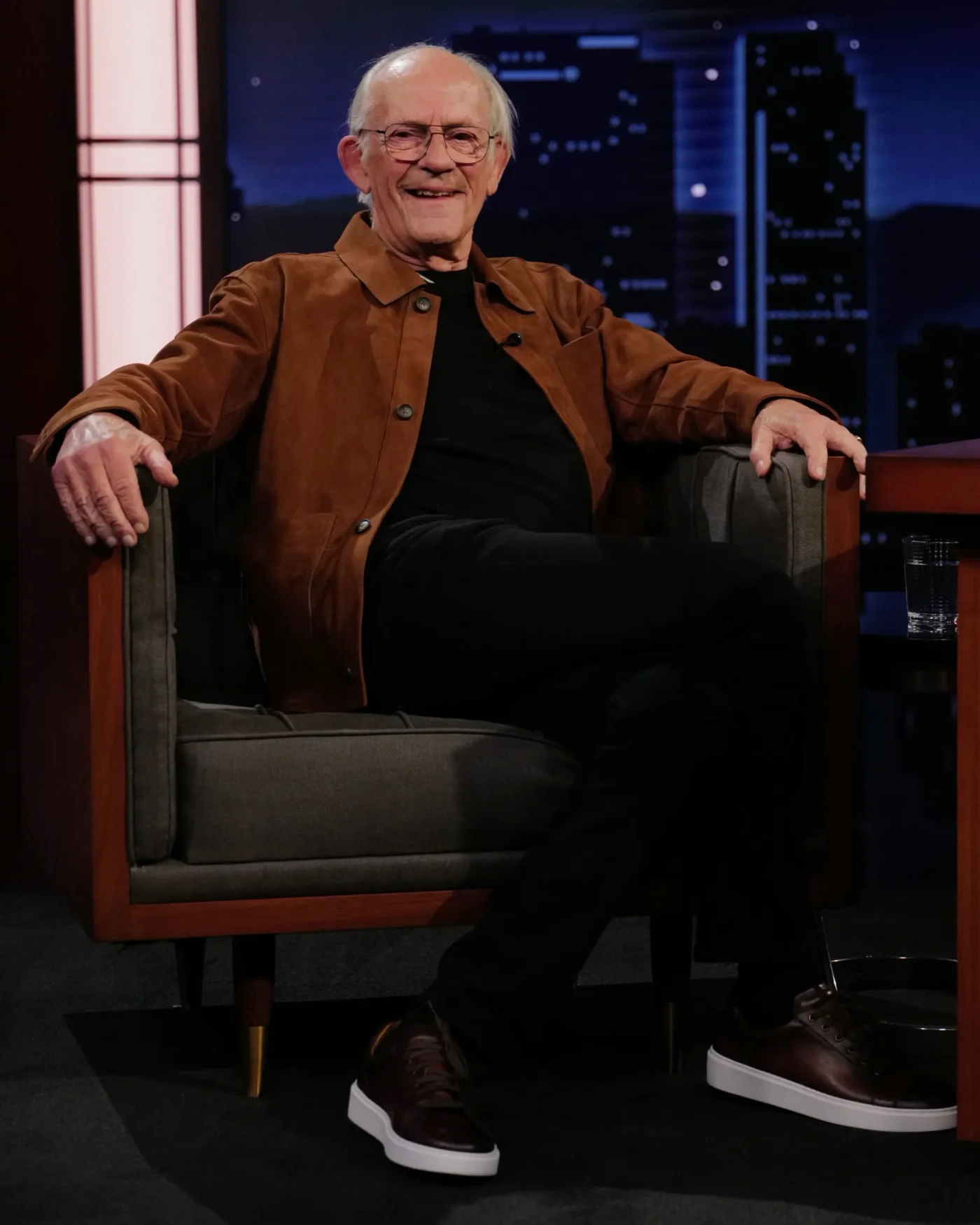 Actor Christopher Lloyd sitting on a chair on Jimmy Kimmel Live!.