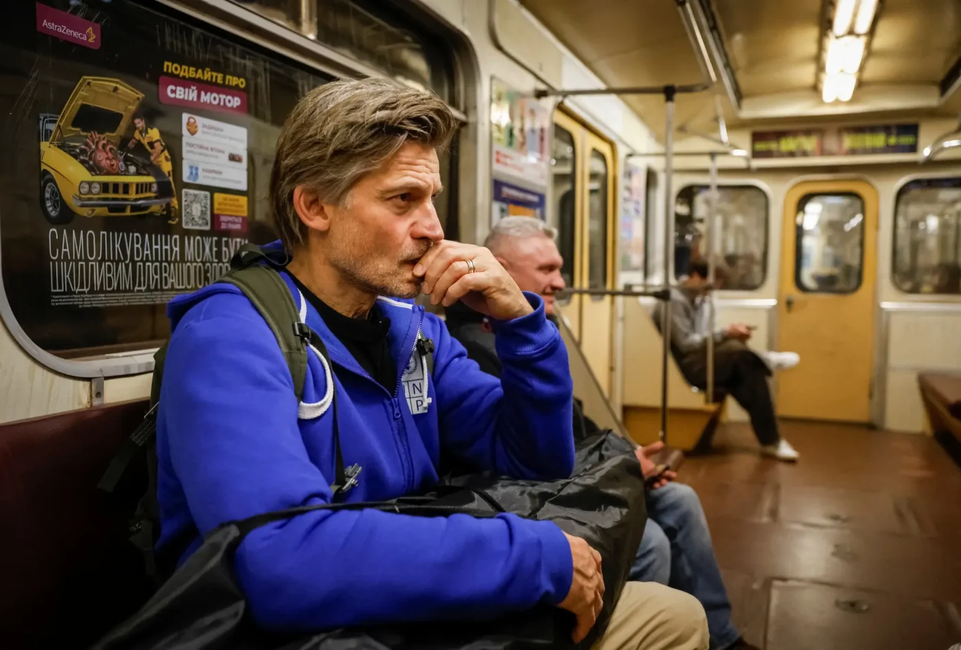 Actor Nikolaj Coster-Waldau rides a train to take shelter inside a metro station in Kyiv.