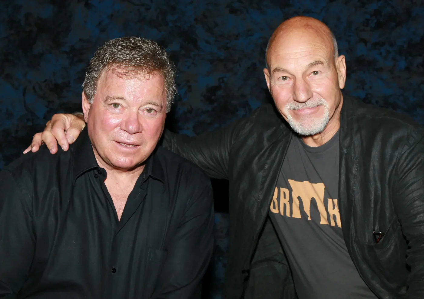 Actors William Shatner and Sir Patrick Stewart pose together.