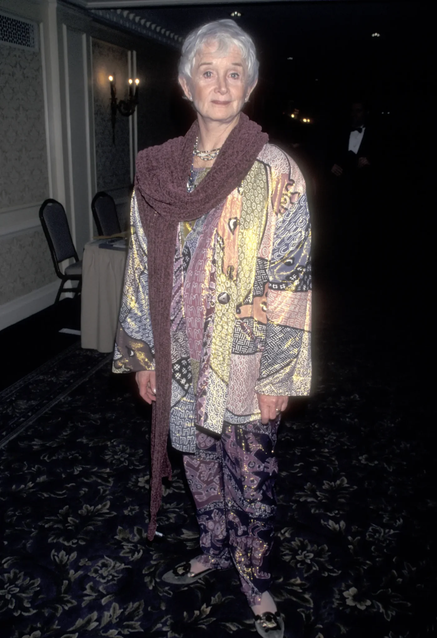 Actress Barbara Barrie attends an awards ceremony wearing a patterned tunic, matching pants, and a dark scarf.
