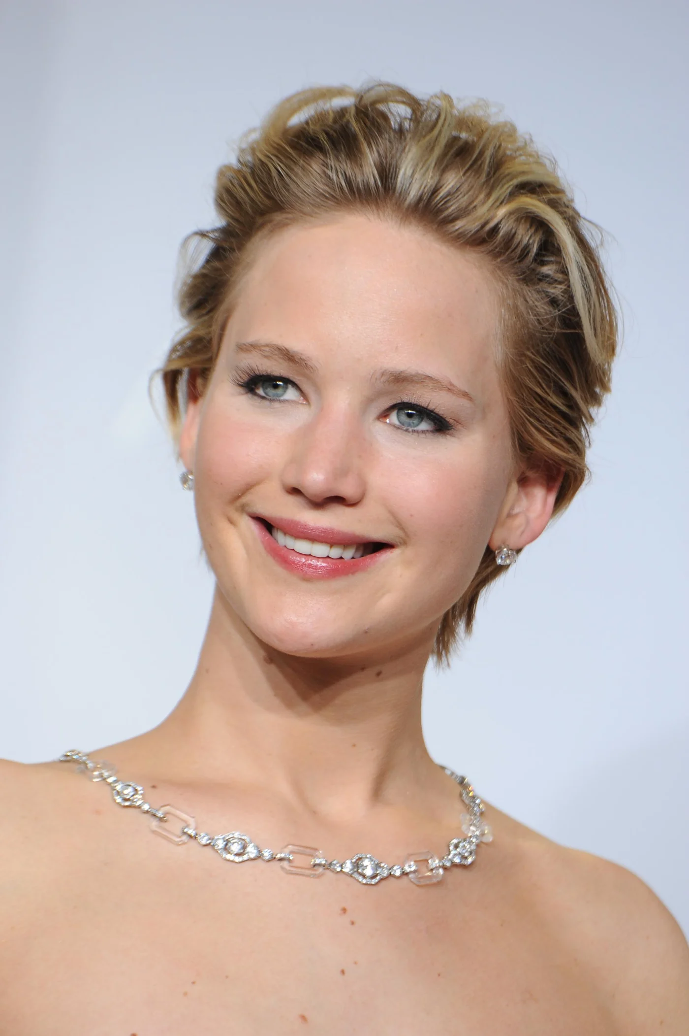 Actress Jennifer Lawrence posing in the press room.