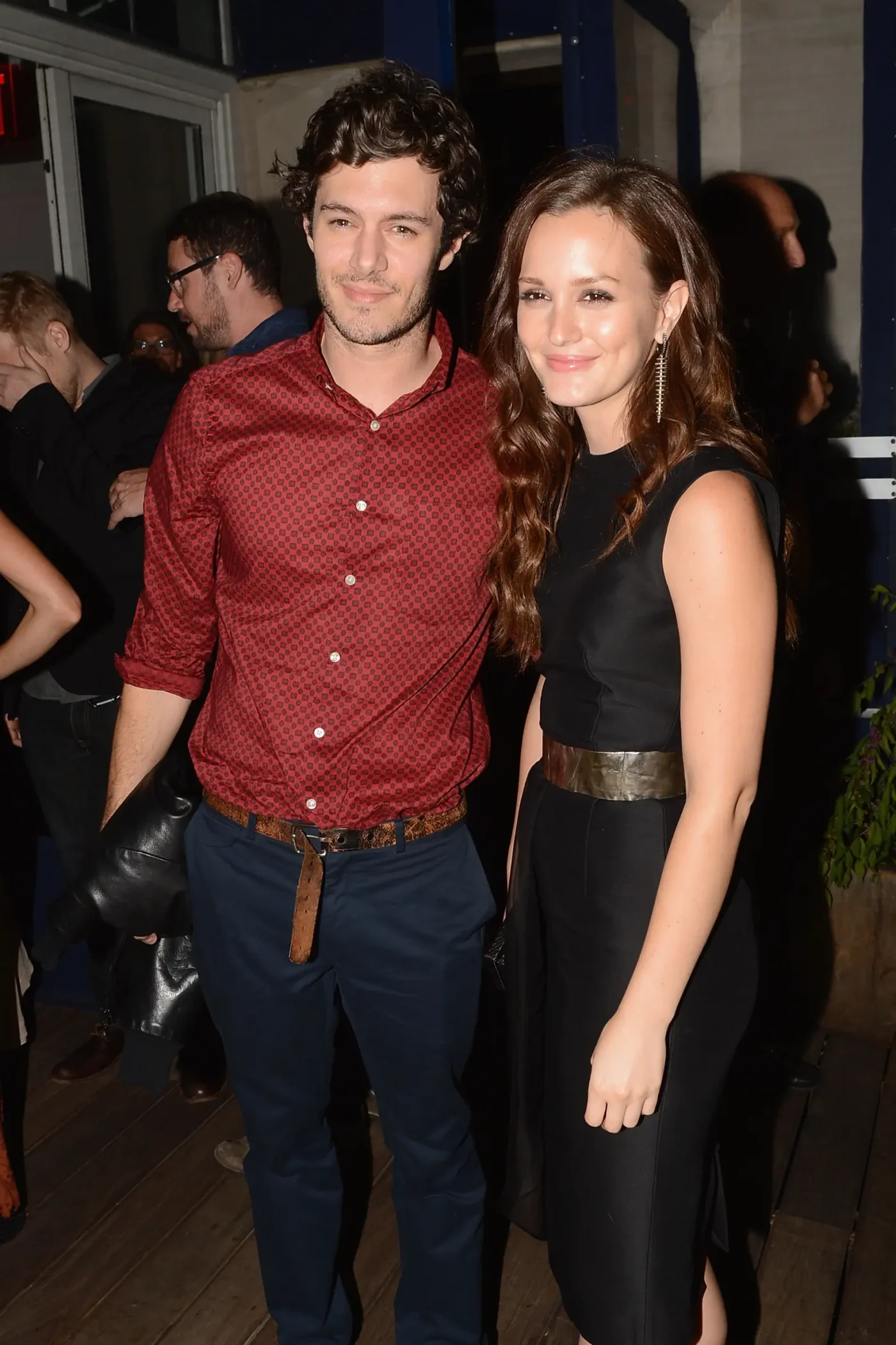 Adam Brody and Leighton Meester pose together at an event.