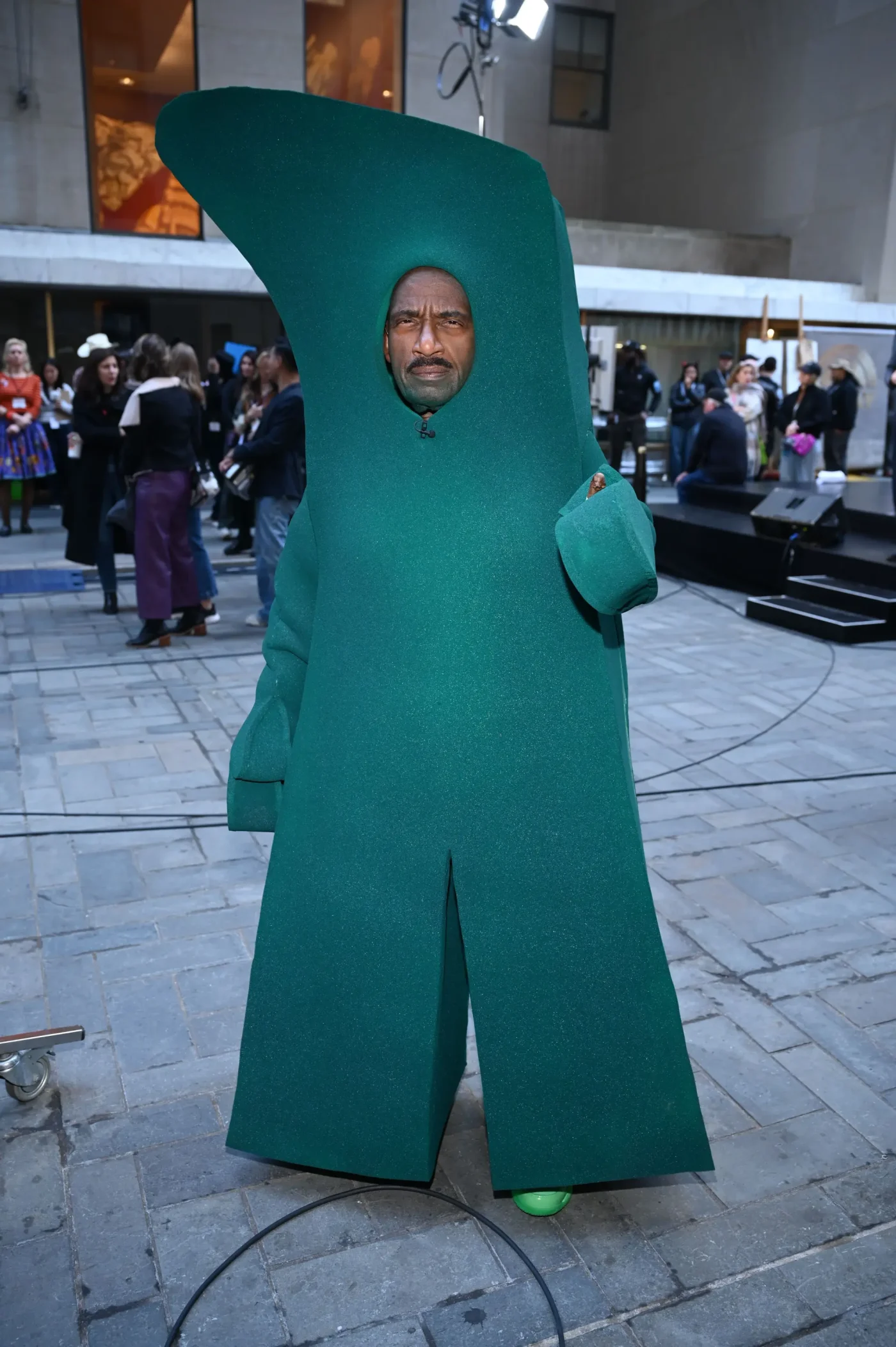 Al Roker in a large green costume at the TODAY Halloween Extravaganza.