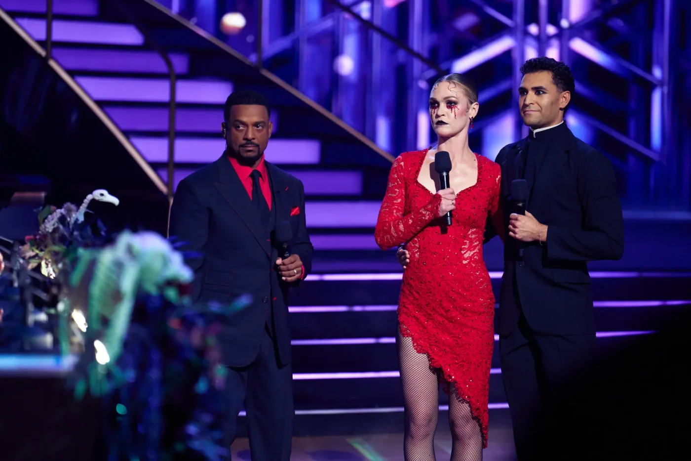 Alfonso Ribeiro, Julia Stiles, and Ezra Sosa on the ballroom floor during