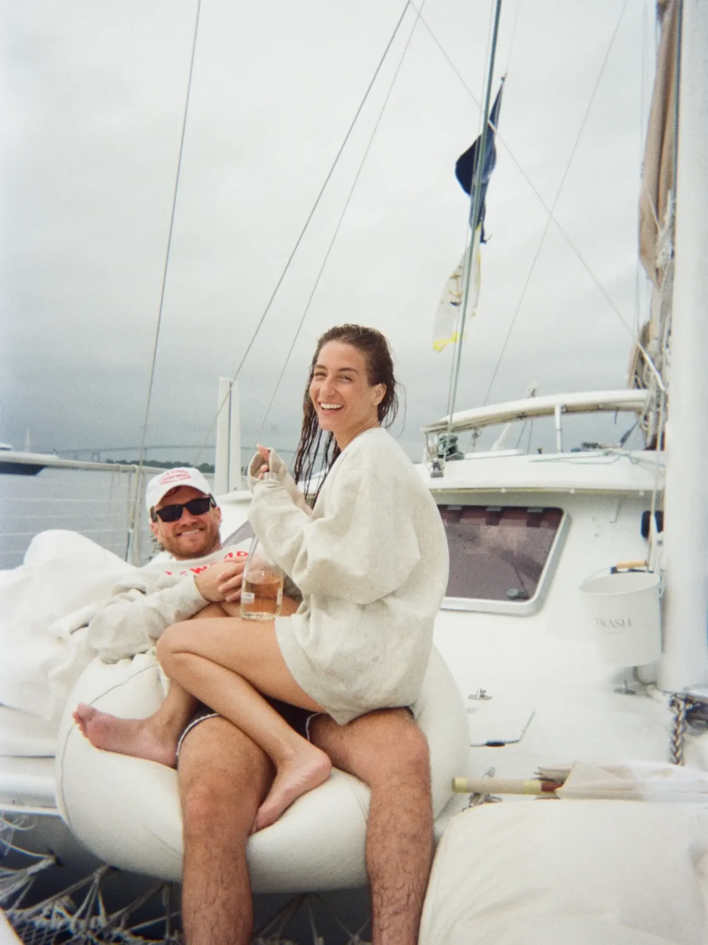 Amanda Batula and West Wilson sitting together on a boat.