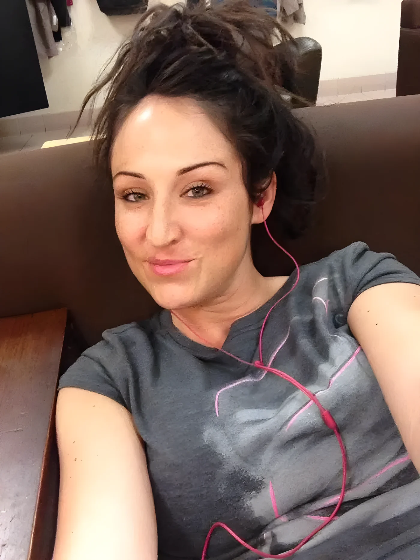 Amber Siyavus sitting on a couch.