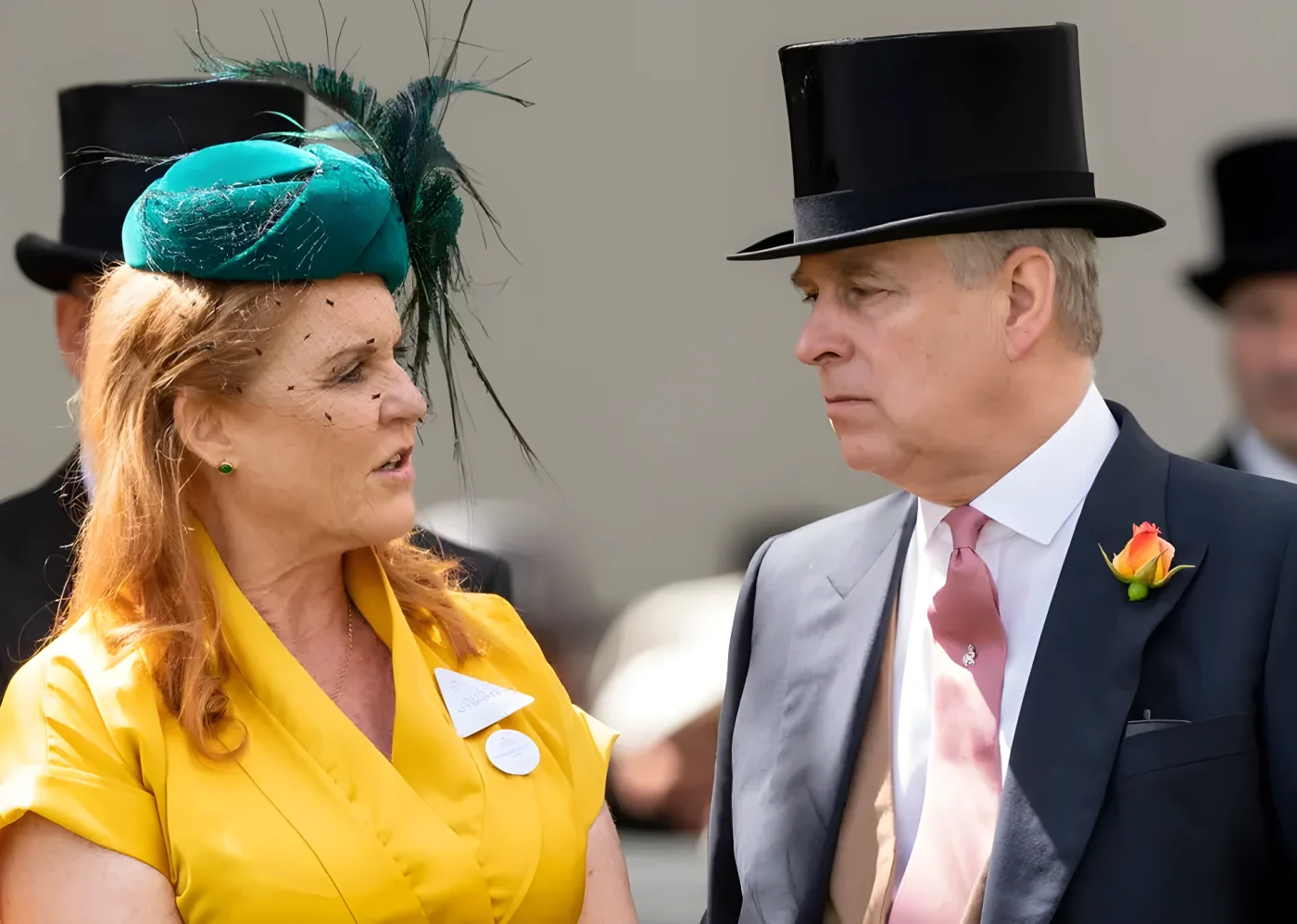 Andrew in top hat and Sarah Ferguson in yellow dress talking to eachother