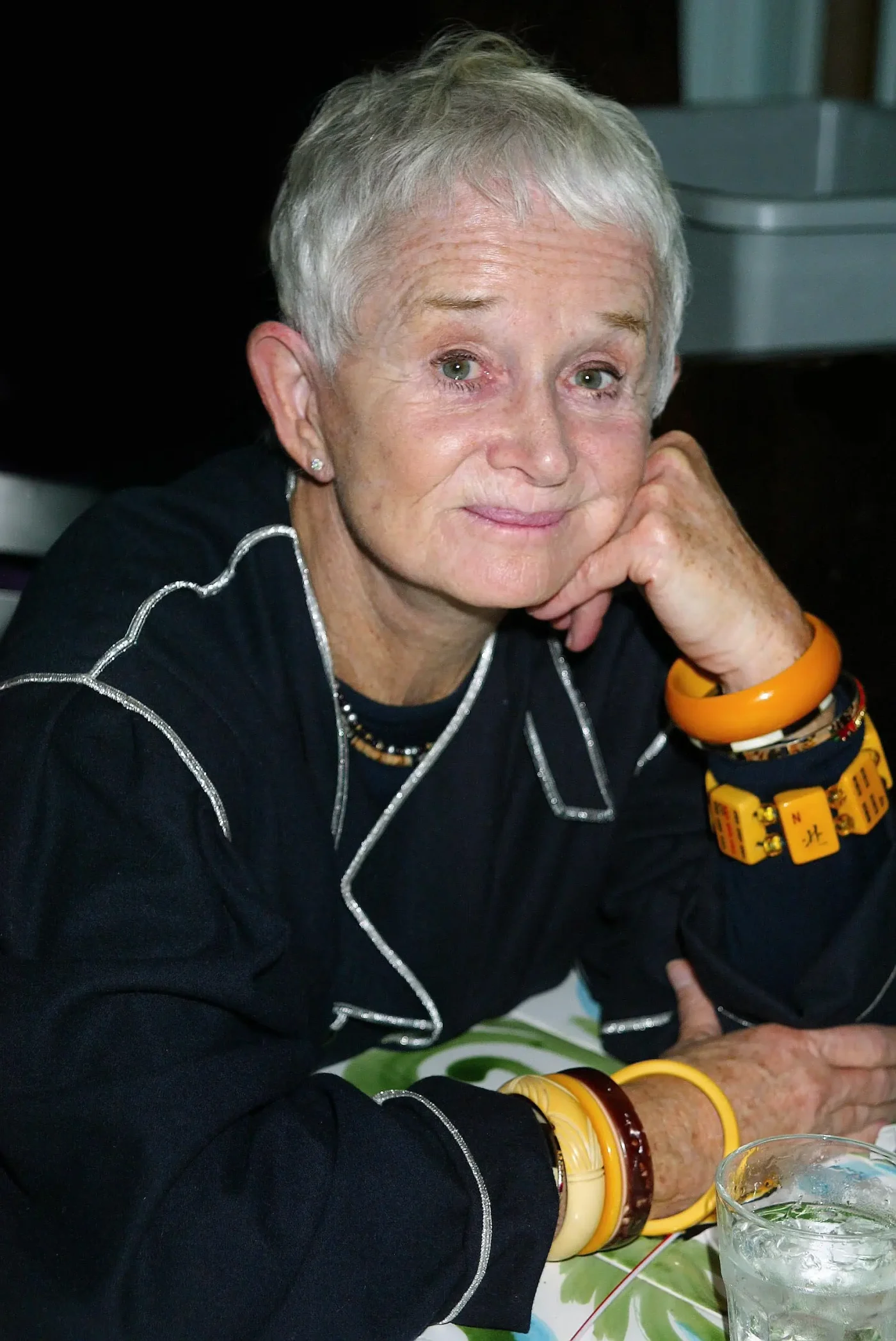 Barbara Barrie resting her chin in her hand while attending an event.
