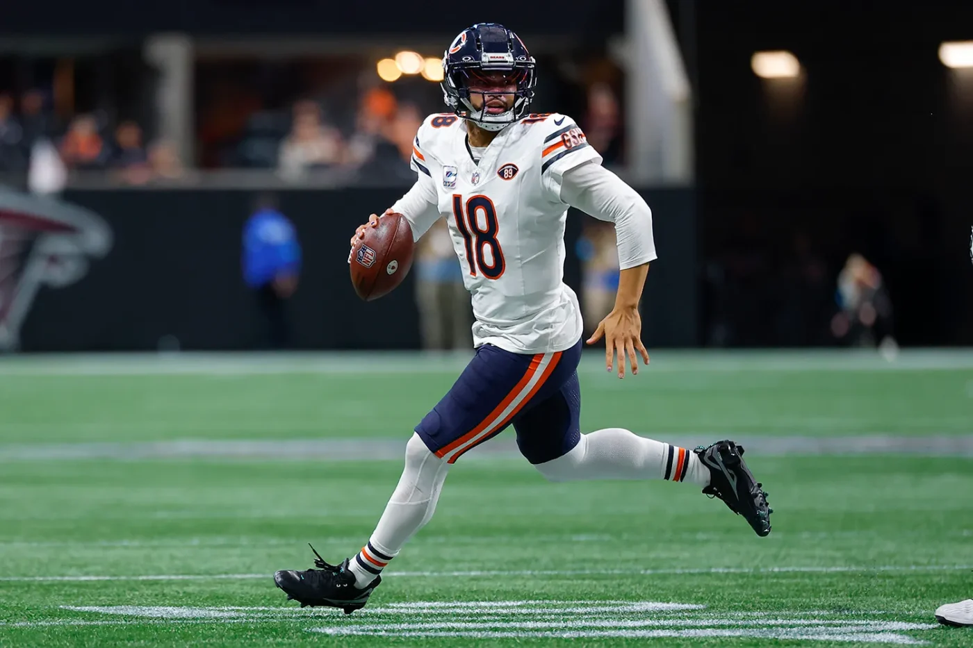 Caleb Williams #18 of the Chicago Bears scrambles during the third quarter against the Atlanta Falcons at Mercedes-Benz Stadium on October 18, 2026 in Atlanta, Georgia