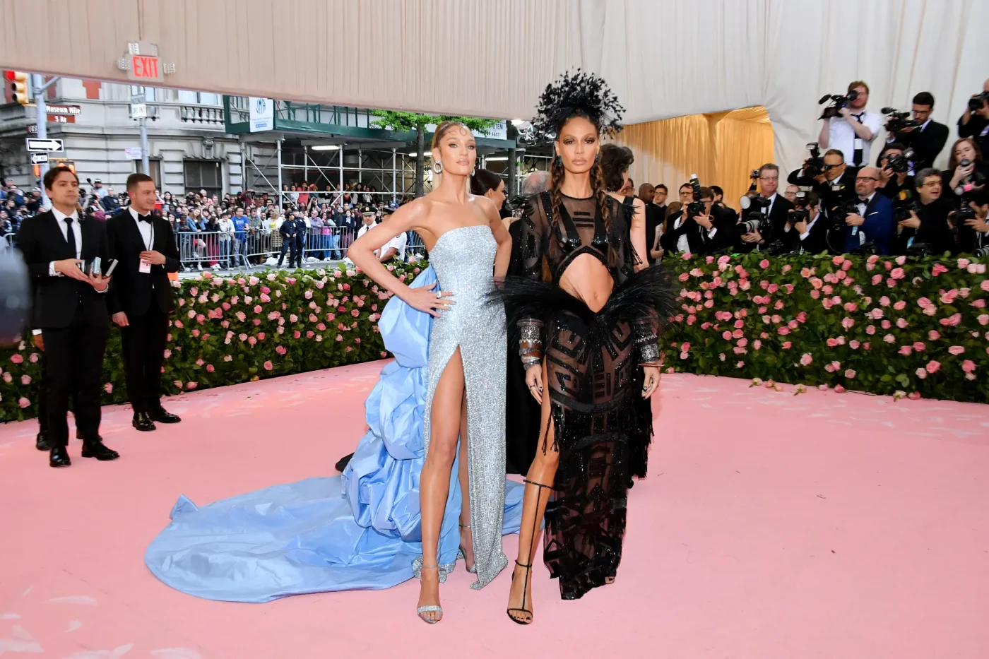 Candice Swanepoel and Joan Smalls posing on the pink carpet at the Met Gala.