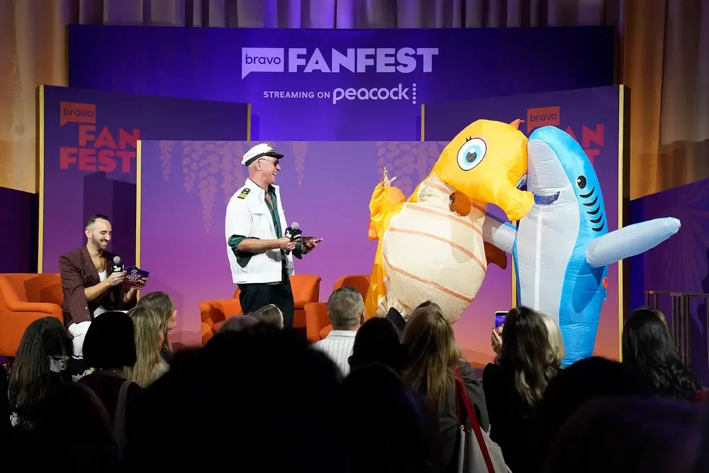 Captain Lee Rosbach and inflatable sea creature costumes on stage at Bravo FanFest.