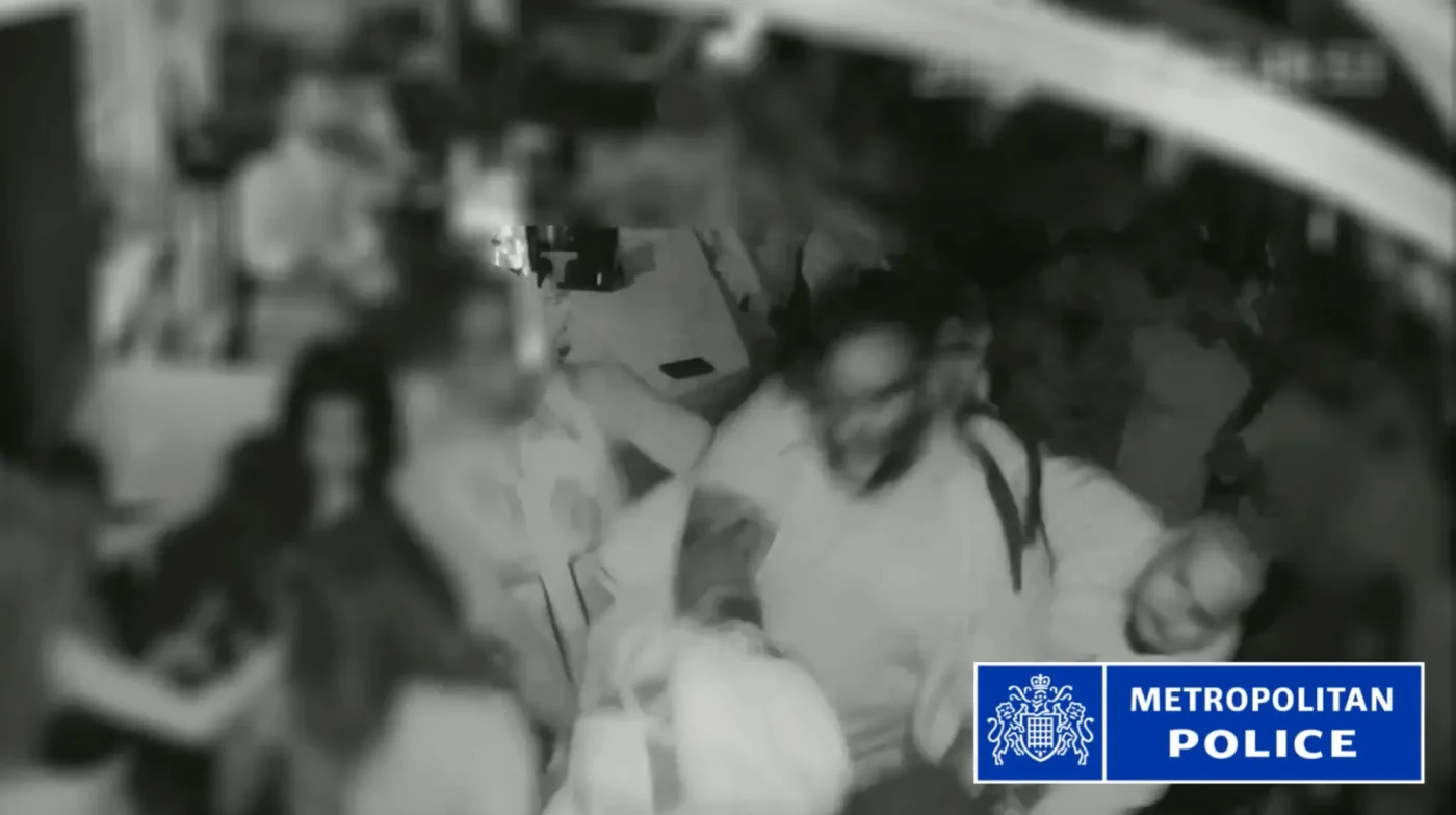 CCTV footage of Chris Brown hitting a producer over the head with a bottle in a London club.