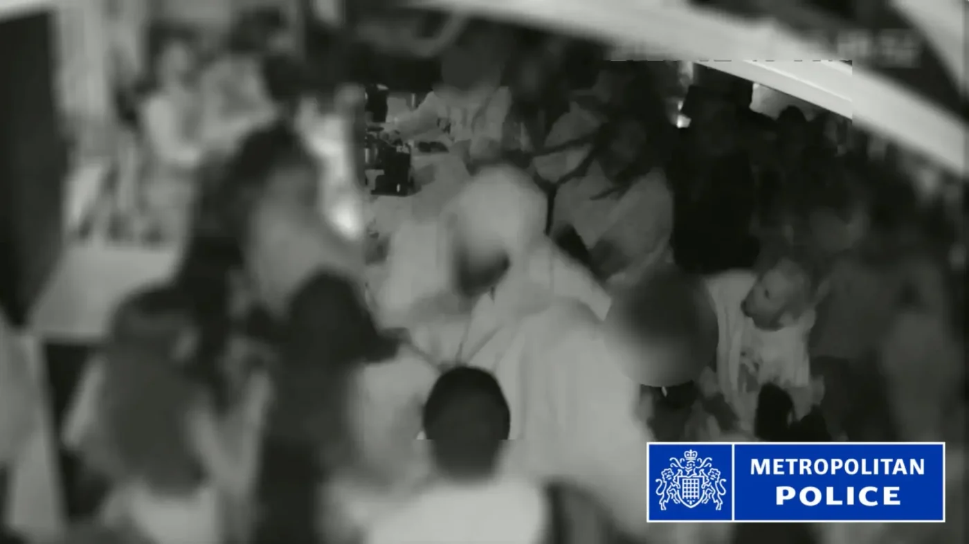 CCTV still showing Chris Brown hitting a producer with a bottle in a London club.