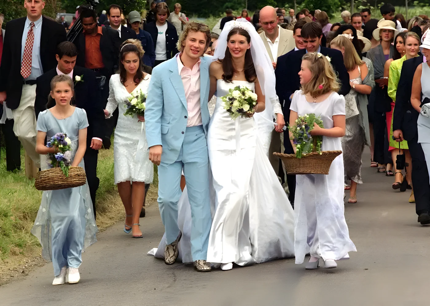Celebrity television chef Jamie Oliver (wearing a blue Paul Smith suit) and his bride Juliette Norton (Jools) after their wedding ceremony at All Saints Church , Rickling, in Essex.