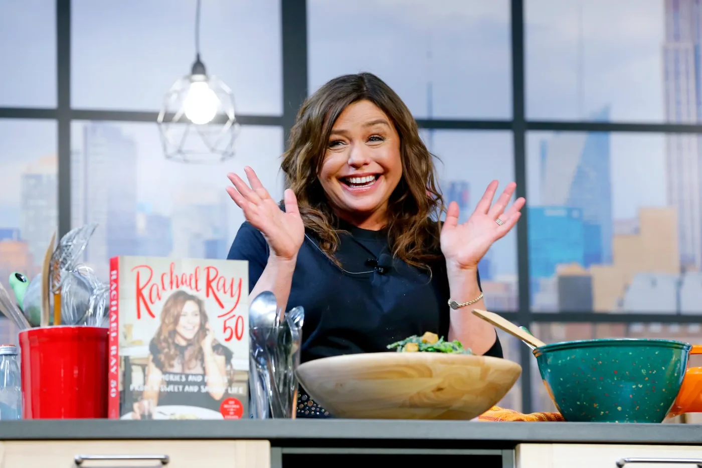 Chef Rachael Ray on stage during a culinary demonstration.