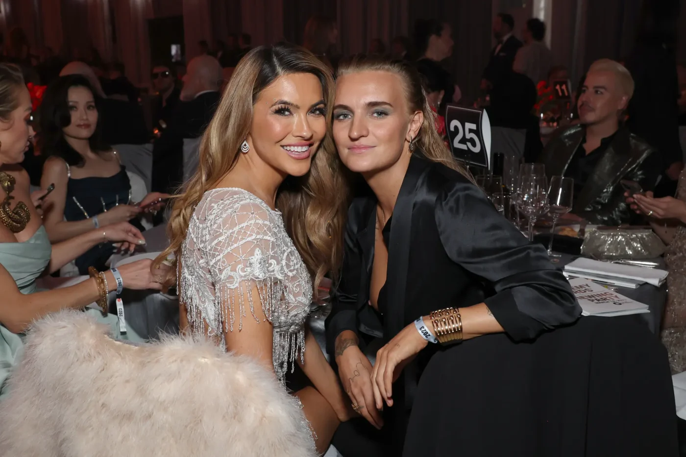 Chrishell Stause and G Flip pose together at an event.