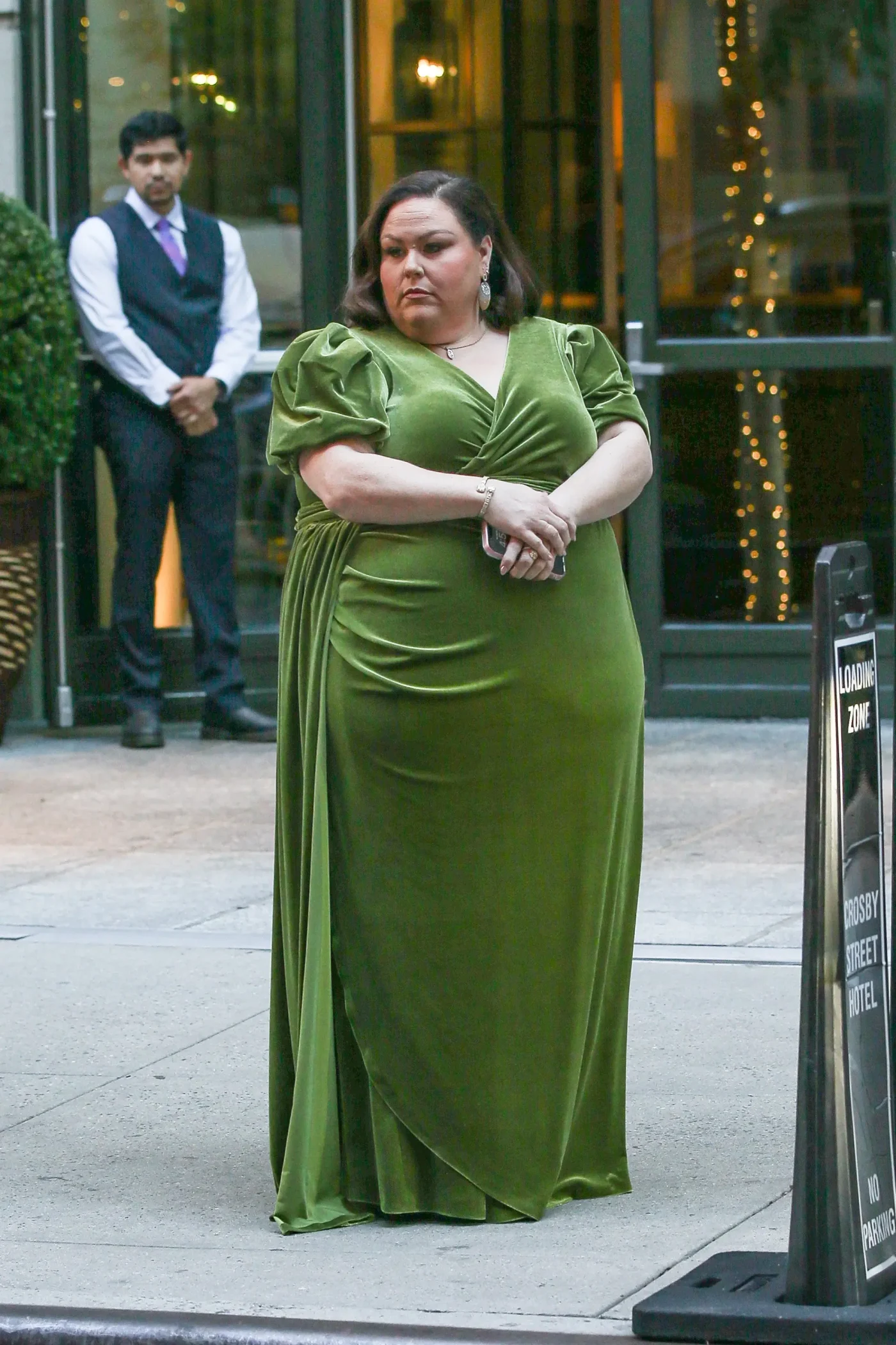 Chrissy Metz wearing an olive green velvet dress outside the Crosby Hotel in New York City.