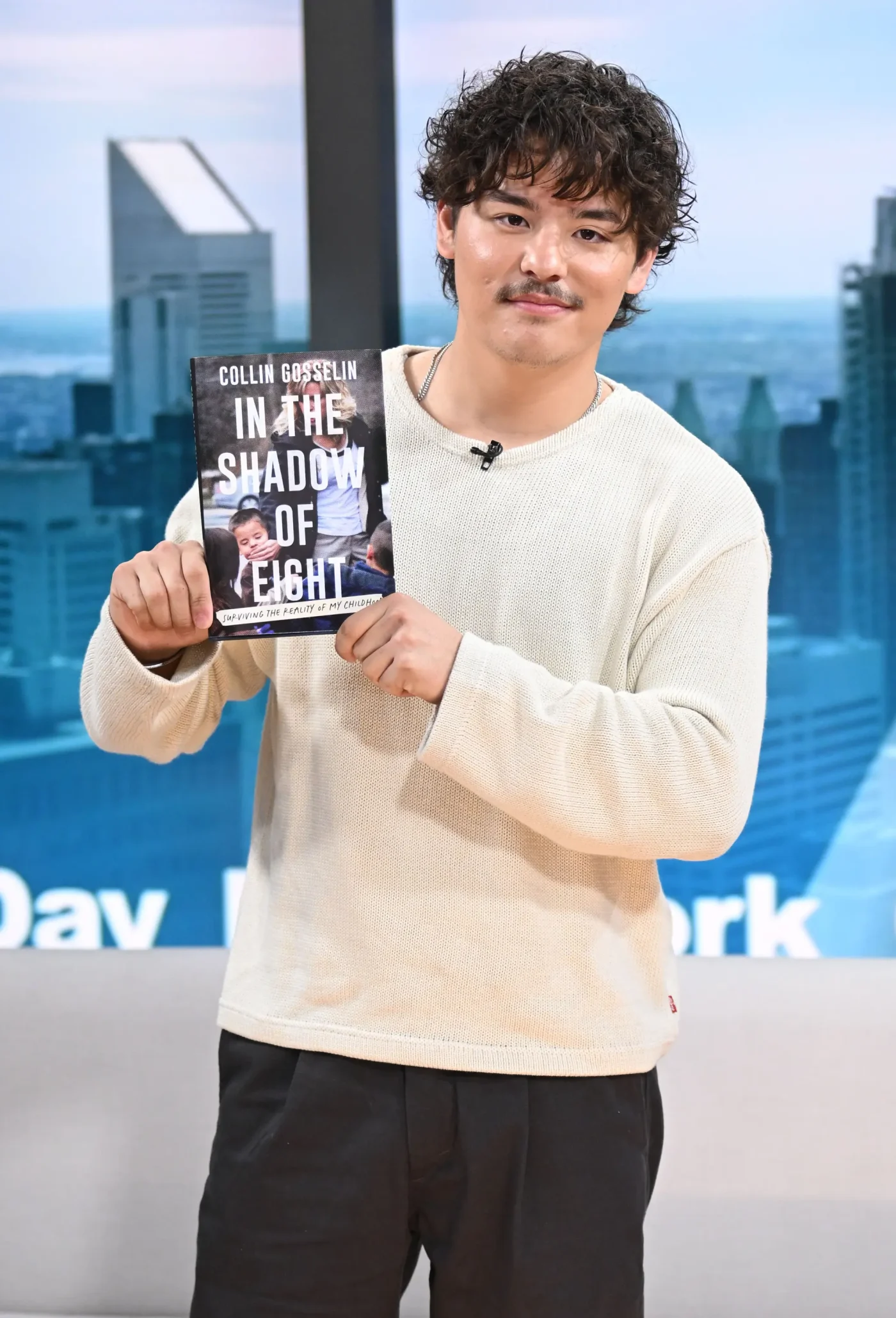 Collin Gosselin holding his book