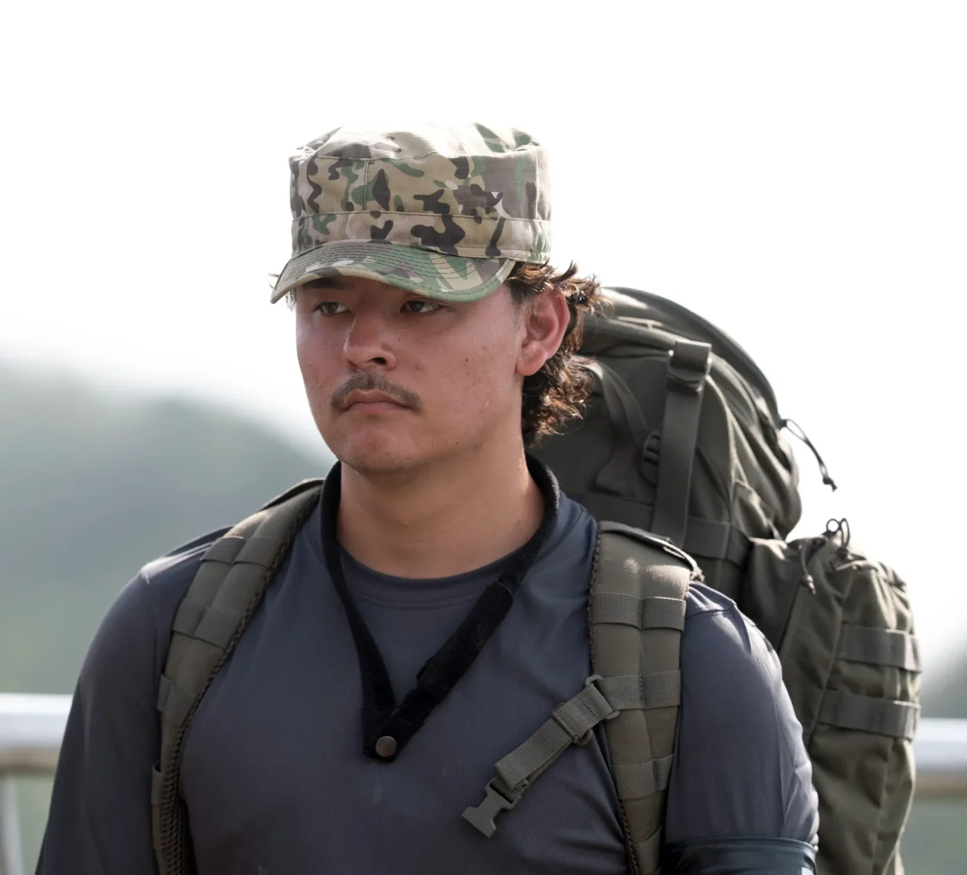 Collin Gosselin wearing a camo cap and carrying a backpack on Special Forces: World’s Toughest Test.
