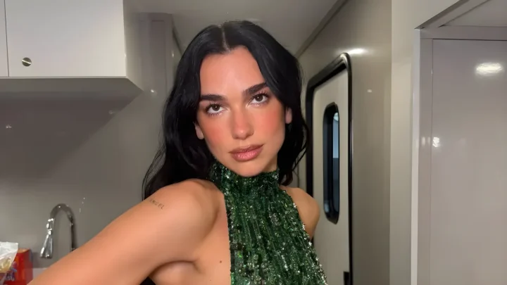 Dua Lipa Stuns in a Cutout Emerald Gown and Sheer Designer Fits While Offering a Rare Look at Married Life