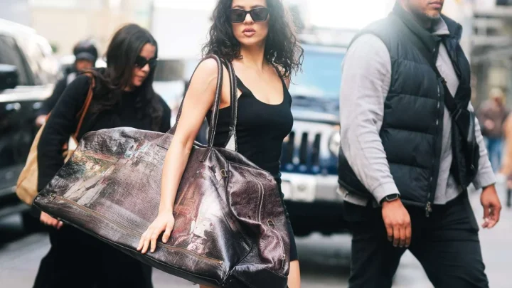 Rosalía Shuts Down New York City Streets With a Massive 3-Foot Leather Holdall and Archival Gaga Ballet Heels