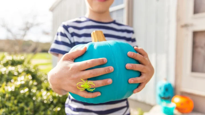 Why Are Neighbors Putting Teal Pumpkins and Blue Buckets on Their Porches This Halloween? The Meaning Behind the Viral Colors