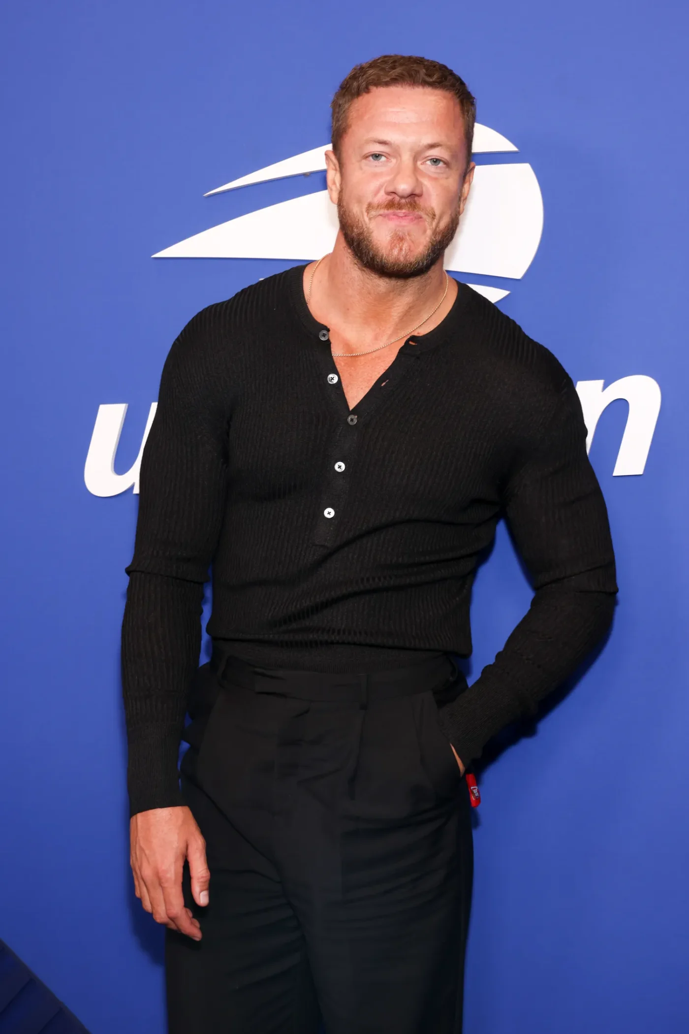 Dan Reynolds in black at an event