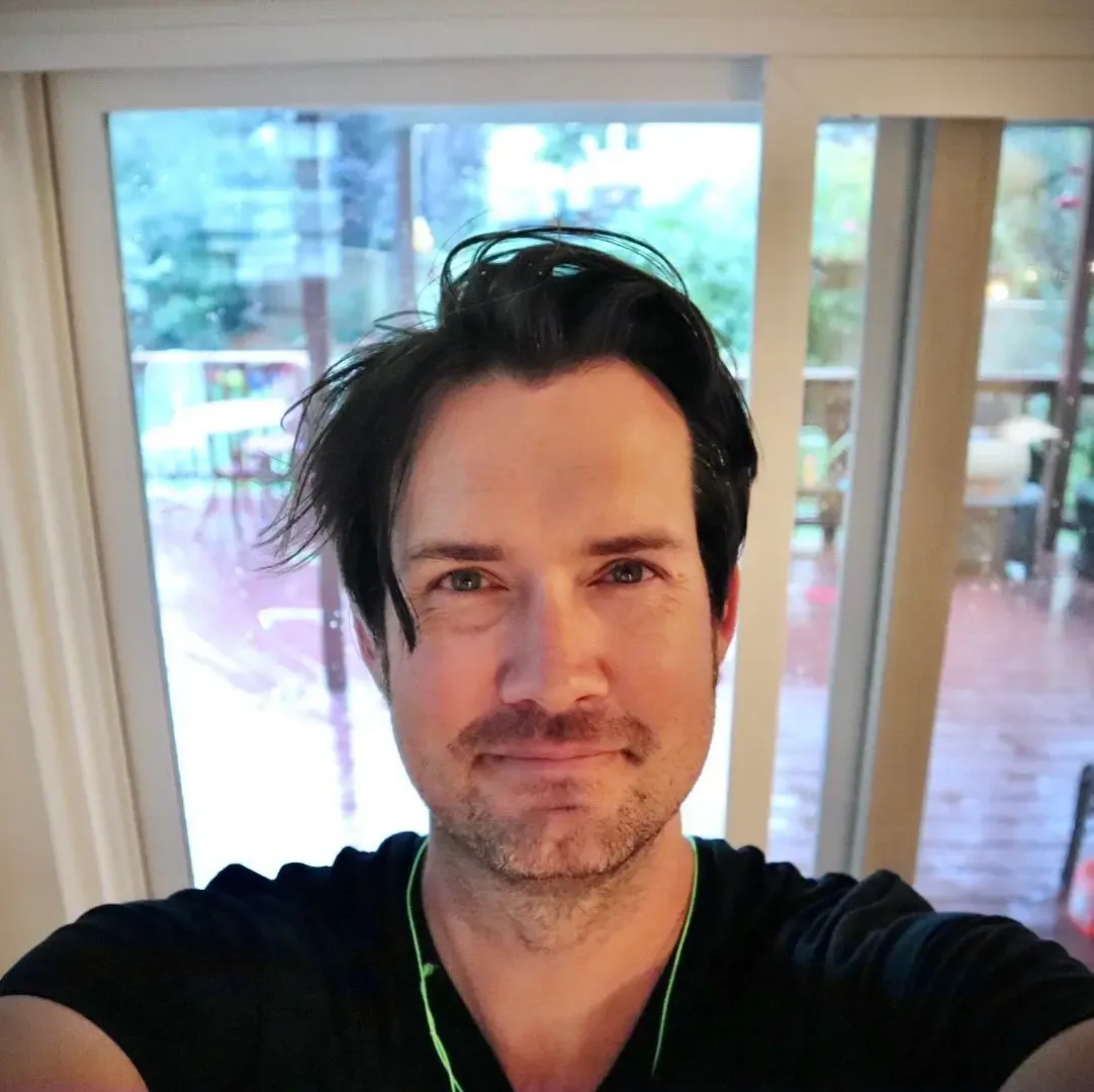 David Bowick taking a selfie indoors.