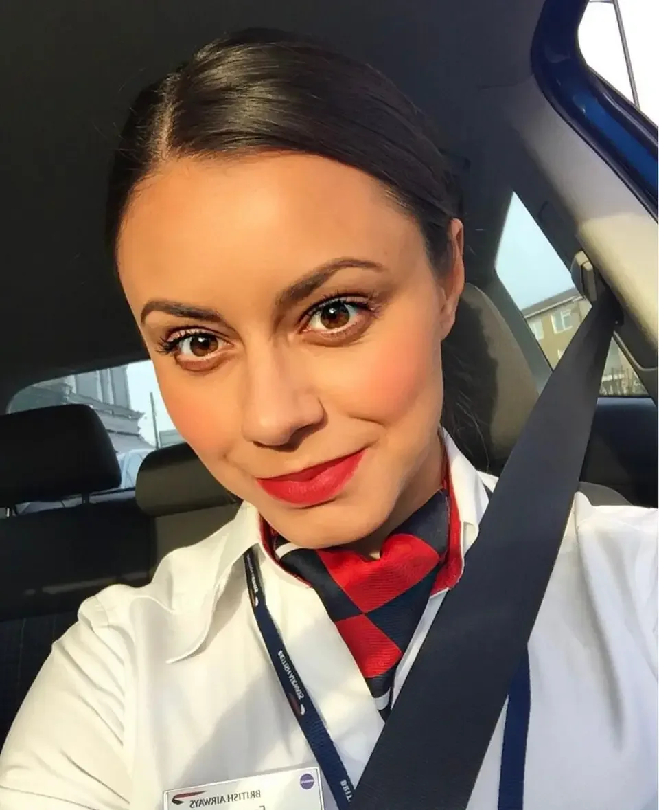 Emma taking a selfie dressed in her cabin crew outfit