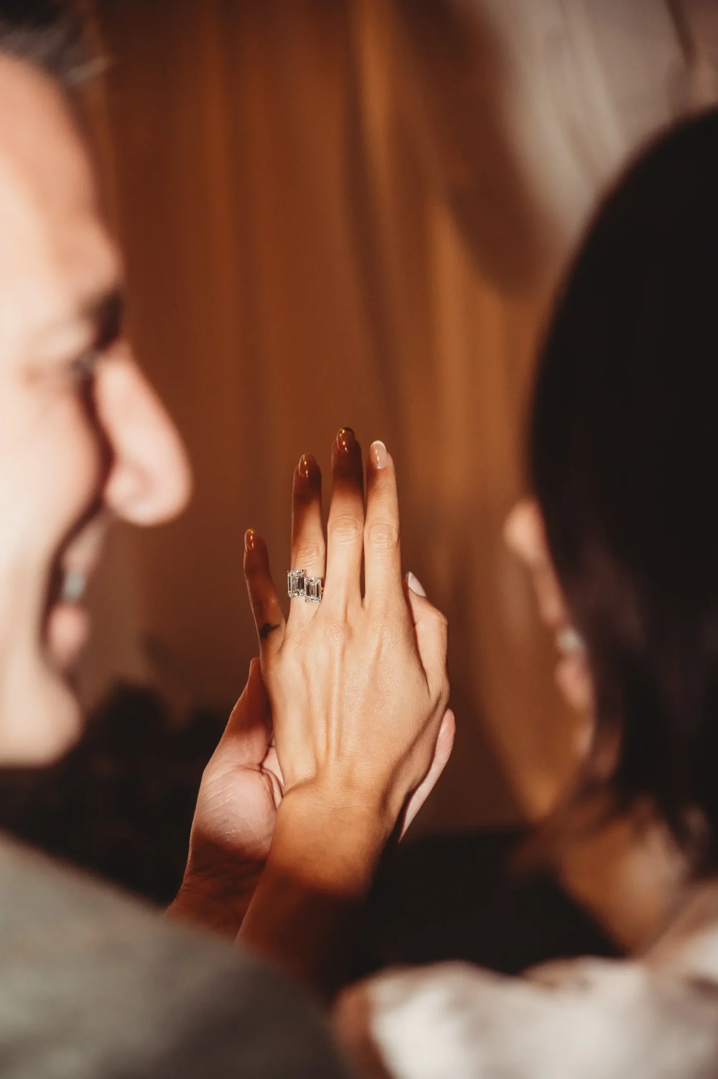 Equinox chairman Harvey Spevak and former GDNY co-anchor Bianca Peters smiling while showing off an engagement ring.