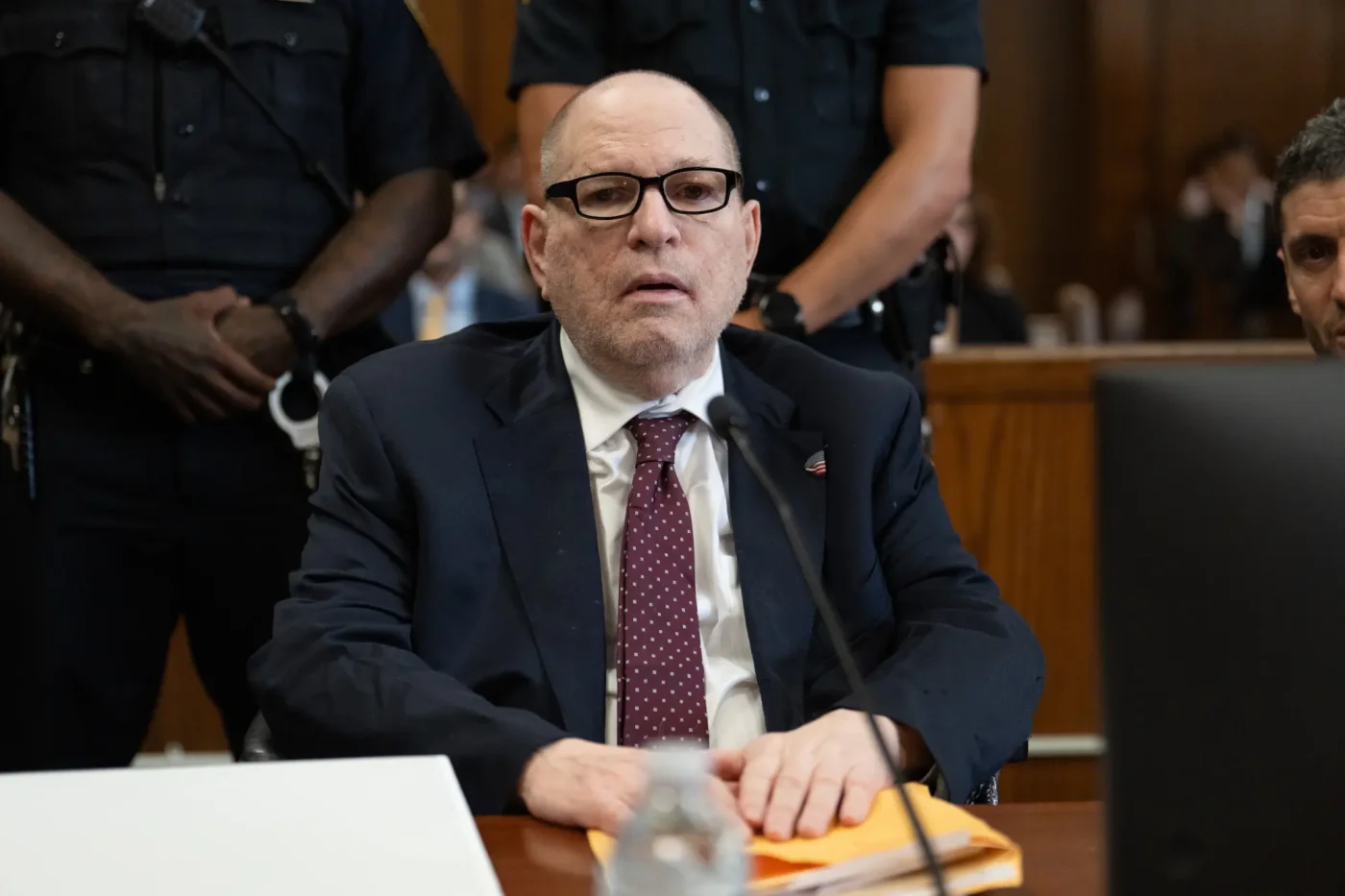 Former film producer Harvey Weinstein sits in a Manhattan criminal court for sentencing in the sexual assault of Miriam Haley.
