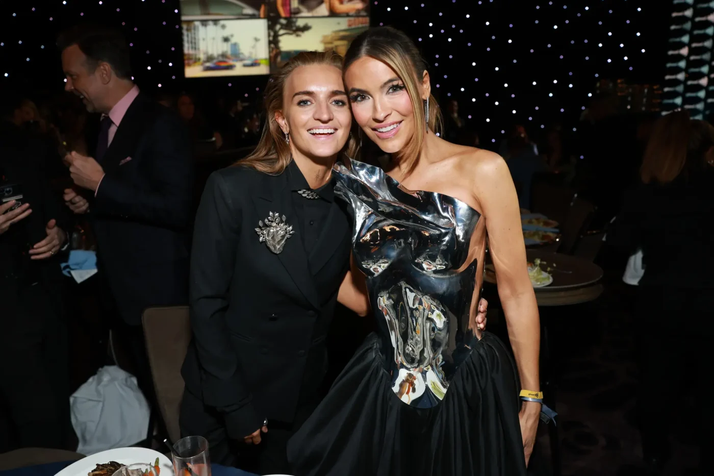 G Flip and Chrishell Stause pose together at an awards event.